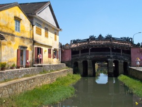 japanese bridge next to colonial building